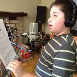 Christian recording a voiceover for Joseph Farms in Spanish