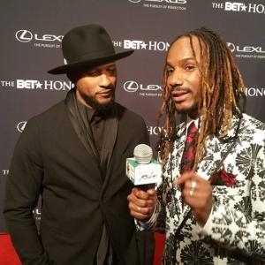Howard interviewing Usher Raymond on the Red Carpet at the 2015 BET Honors