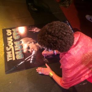 Lyn Quinn signing The Soul of Blue Eye poster for Loyal Studios while attending the LA Indie Film Festival.