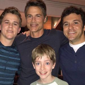 Connor Kalopsis with Fred Savage Rob Lowe and John Owen Lowe on set at The Grinder