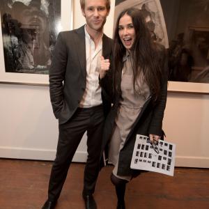 LOS ANGELES CA  MAY 09 Artist Bryan Fox L and actress Demi Moore attend We Alone A photography exhibit by Bryan Fox at Think Tank Gallery on May 9 2015 in Los Angeles California Photo by Jason KempinGetty Images for Bryan Fox