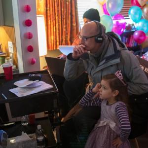 Abby Ryder Fortson starring as Cassie Lang Paul Rudds Daughter in Marvels AntMan Here watching playback with director Peyton Reed