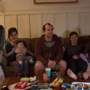 Abby Ryder Fortson stars as Sophie Pearson, the daughter of Mark Duplass and Melanie Lynskey, in HBO's Togetherness. Pictured: Amanda Peet, Melanie Lynskey, Steve Zissis, Mark Duplass, and Abby Ryder Fortson
