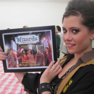 Brittany Rizzo holding her 100th episode of Wizards Of Waverly Place plaque