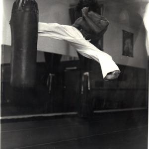 Don McGovern vintage shot,Jump spinning round kick into heavy bag. Chuck Norris days.....