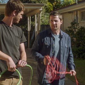 Still of Tim Guinee and Andrew Garfield in 99 Homes 2014