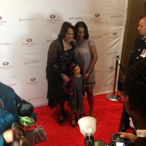 Aaliyah Cinello on the red carpet with her mom Raven Cinello and Dr. Bernice King.