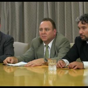 Still of Dean Dawson (center) as President Hunt on Into the Flames for Chosun Television.