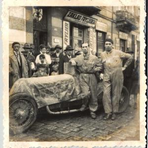 The Italian Racing Team in Lwow (circa 1932). The racecar driver is likely Achille Varzi or Tazio Nuvolari. Photo shot by Victor Perantoni, his father Carlo Perantoni is in the background.