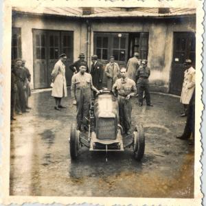 The Italian Racing Team in Lwow (circa 1932). The racecar driver is likely Achille Varzi or Tazio Nuvolari. Photo shot by Victor Perantoni, his father Carlo Perantoni is in the background.