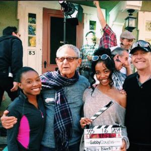 Kyal Legend with Imani Hakim producer Zev Braun and Director Gregg Champion on set of The Gabby Douglas Story