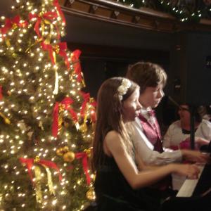 Professional pianists Malia and her brother Christian Laurian Kerr playing at W Brett Wilsons annuual Christmas event