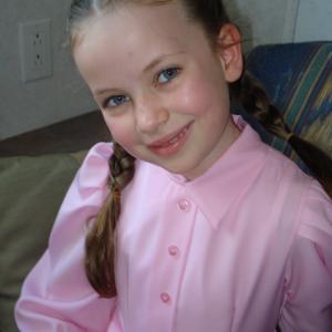 Malia as Mormon little girl Angela Alton on the movie set of The 19th Wife