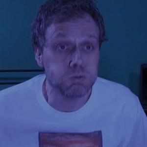 Kevin Meredith waking up from his computer nightmare in the first wepisode of his new webseries Shoot your Computer