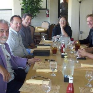 Meeting with directors Rod Hardy (purple jacket) and Larry McLean (to Cheryl's left) on several projects.