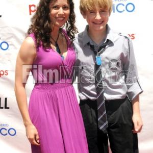 HOLLYWOOD, CA - JUNE 23: Actress Casey Dacanay and actor Nathan Gamble arrive for '25 Hill' - Los Angeles Premiere And Soap Box Race held at American Cinematheque's Egyptian Theatre on June 23, 2012 in Hollywood, California. (Photo by Alber