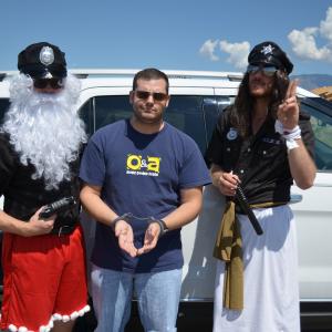 Nathan Brimmer as 'Sgt Cringle', Barry R. White as 'Naughty Perp', and Adam Luaces as 'Officer Christ' in 