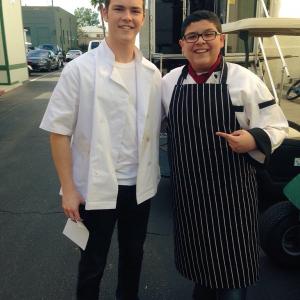 Garrett posing with Rico Rodriguez Manny on the set of ABCs Modern Family