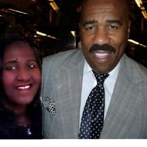 Film Producer Tone Brown with Steve Harvey during a taping of Family Feud game show