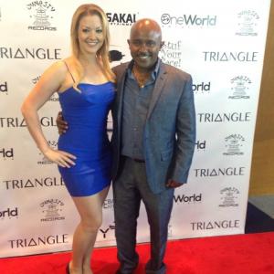 Jessica ProducerActor and Teddy Teshome WriterDirector on the red carpet for the premiere of Triangle