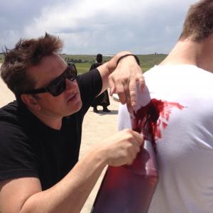 Director Brian McCulley inspects make up on the set of 