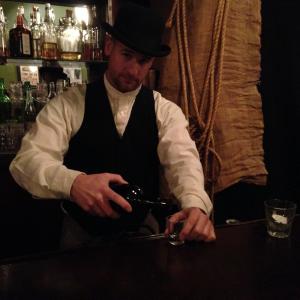 James Quinn (JQ) as the 1892 barkeep in the short film 