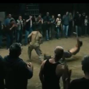 James Quinn screen capture from the trailer for Out of the Furnace! JQ black tank top bottom middle of screen
