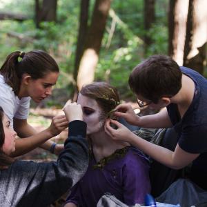 Julia Frangione Laura Gray and Morgana McKenzie performing makeup touchups on Rose Donoghue as The Fairy on the set of We All Go the Same