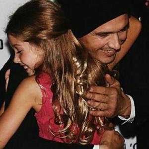 Stella Allen getting a hug from James Franco at the Toronto International Film Festival (2014)