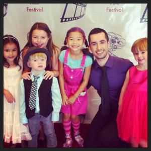 Julian LeBlanc posing with mini fans at the 2nd annual Canadian Young Artist Film Festival