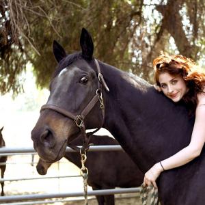 Suzanne LaChasse and her rescued racehorse Pyro on her familys ranch