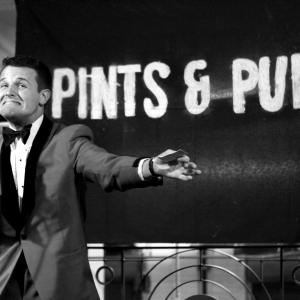 Mark Sipka performing at Pints & Puns Anniversary show.
