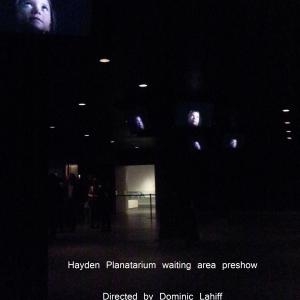 Hayden Planetarium waiting area preshow Multiple screens of CaliQ