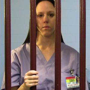 Ashley Miller (Debra van Gaalen) lock in a prison cell during a scene from Daughter of the King