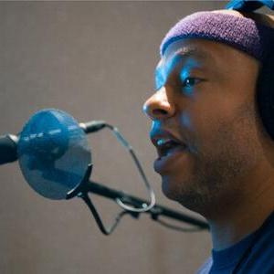 Arif S. Kinchen in the booth while recording 