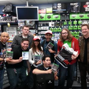 Inside GameStop in BURBANK CA on Nov 22 2013 after signing autographs and games for the Official Midnight Release of The XboxOne and Dead Rising 3 which he also stars in with actor Kirk Bovill pictured on the far right