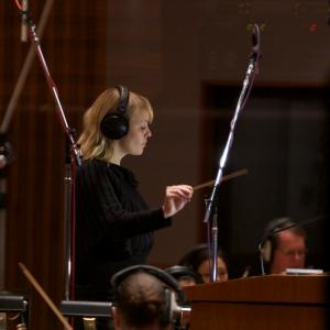 Christine Hals conducting a string orchestra at the Bridge Recording studios in Hollywood. Musicians contracted by Peter Rotter. Recorded by Bobby Fernandez.