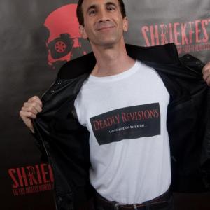 Gregory Blair exposes his Deadly Revisions tshirt while on the red carpet at the Opening Night of the 2013 Shriekfest Horror Film Festival!