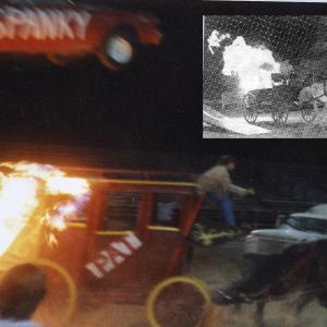 Spanky Spangler Jumps car over burning stagecoach, driven by Pat Larkin, For Worlds Greatest Stunts