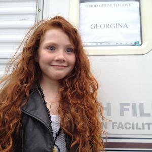 Very excited at the sight of her own mobile on the film set playing Young Georgina in Food Guide to Love 2012!
