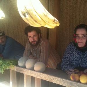 The Husseini Family Pops Hassan and Cousin Fahimeh in the Husseini Flower Fruit and Vegetable Stand in Neka Iran Behind the Scenes shot from the filming of For The Birds  2014   with Jon Raymond and Rafael Zubizarreta Jr