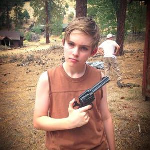 Mikey on set of Our Parents Lied in Pine Mountain Club on location, September 2014. The gun is a nonfunctioning replica made for films.