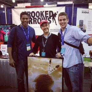 J Todd Harris Caz Rubacky and Reuel Pendleton at Crooked Arrows promo table  National Lacrosse Convention