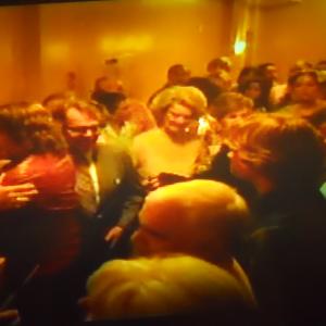 This Is me in HBOs Movie  Behind The Candelabra Im the one with the white flower on the side of my Updo hairstyle Hair gave meIm kind of directly to the right of Matt DamonLike 6 ft Back To His right sideThe One Facing The Camera