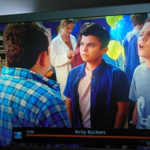 Me again in the Disney XD Show  Kirby Buckets Episode is  Get A Grip Aired July 1st 2015In this shot Im center frame topI am looking downIm the only one wearing a white Lab Coat and holding a clipboardWas playing a Science Teacher