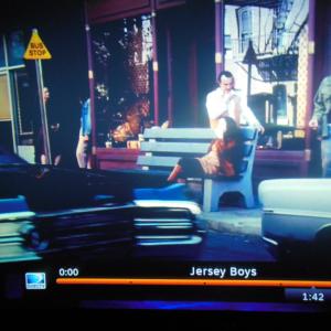 Me again in  Jersey Boys Im the one standing under the Bus Stop SignFrankie Vallis Daughter FrancineFreya Tingleyis sitting on the bench