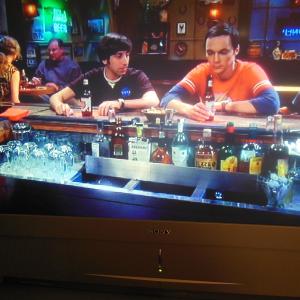 Me again in  The Big Bang Theory Episode is  The Mommy Observation Aired 3132014Im Frame leftBack to cameraBlonde ponytailLarge gold hoop earringsSitting at a table talking to this guy
