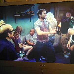 Me In  Its Always Sunny In Philadelphia Episode  Charlie Rules The Day Im the one kind of behind and to the left of Charlie DaySitting on the Sofa sidewaysLong hairRust colored Vest and Jean SkirtAired 1262012