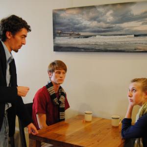 Director Blake Cortright L works with actress Samantha ODell R and Zach Phaneuf M between takes on the set of Spilled Tea 2013