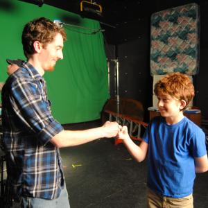 Director Blake Cortright L share a moment on set with actor Bailey Harkins R between takes of The Son ????